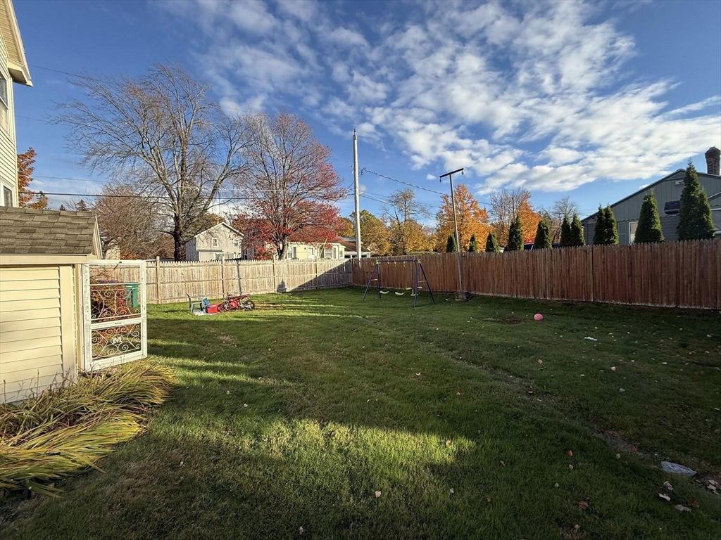 306 Franklin Road, Unit 2 Fitchburg, MA 01420 - Photo 16 of 17 a view of backyard with table and chairs