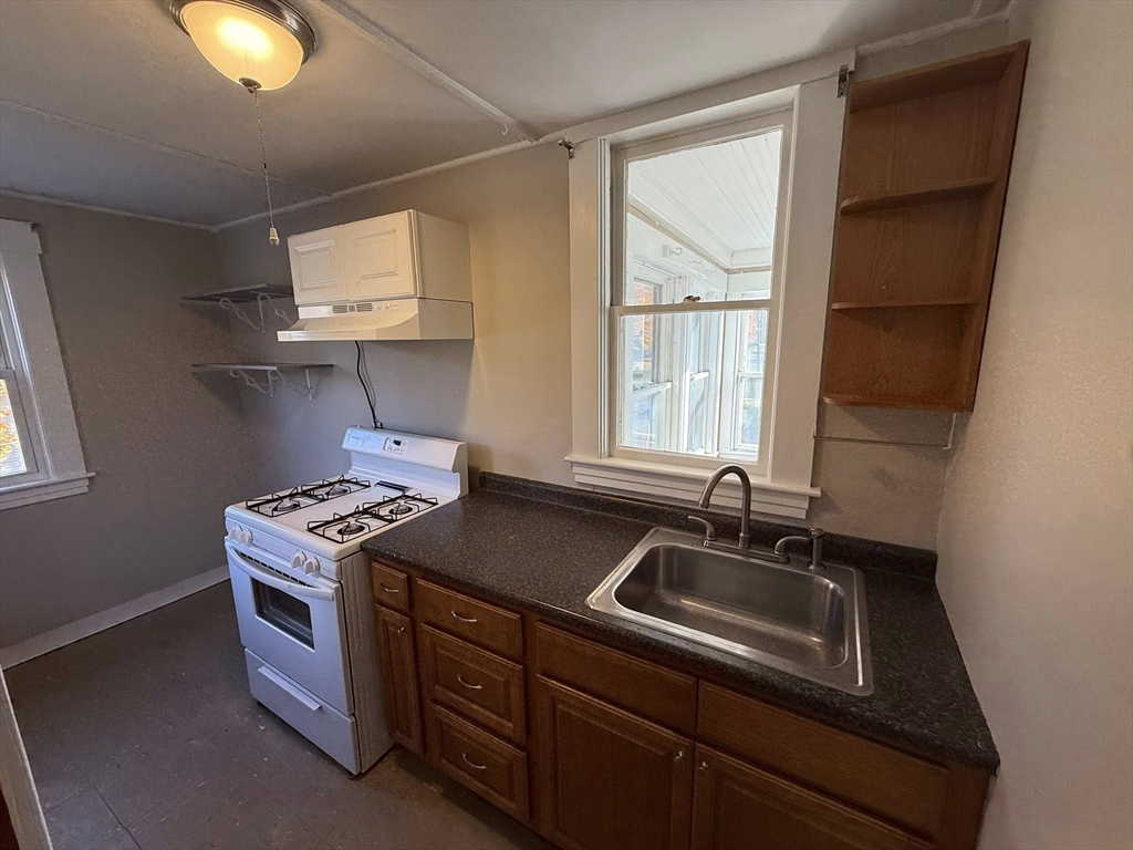 306 Franklin Road, Unit 2 Fitchburg, MA 01420 - Photo 2 of 17 a kitchen that has a sink and a stove