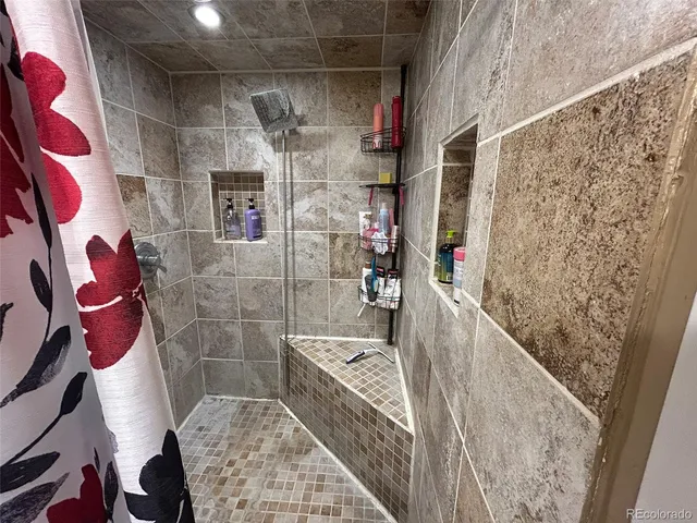 a bathroom with a sink and a shower