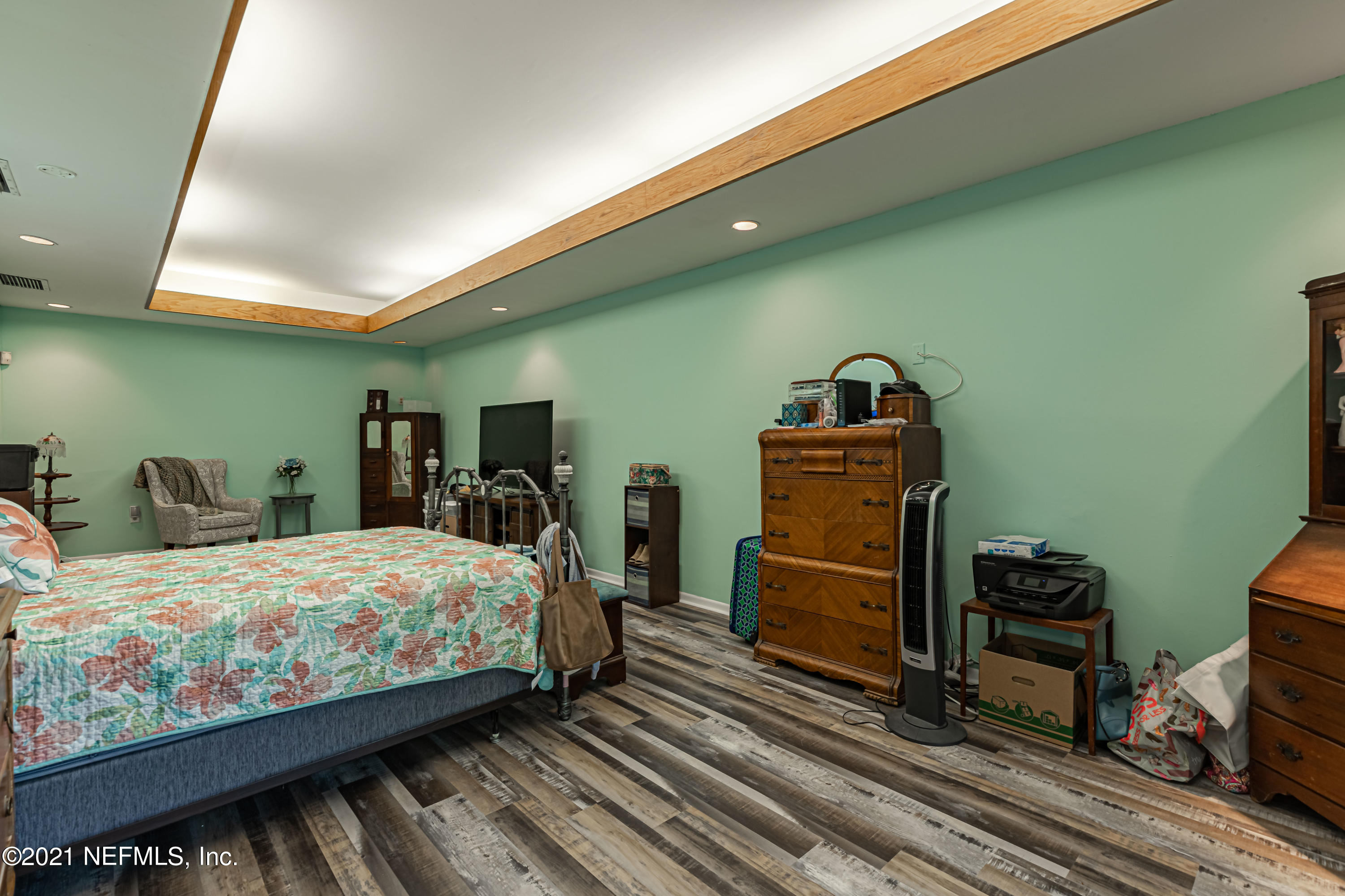 3155 Ravines Road, Unit 3502 Middleburg, FL 32068 - Photo 12 of 25 a bedroom with a bed and wooden floor