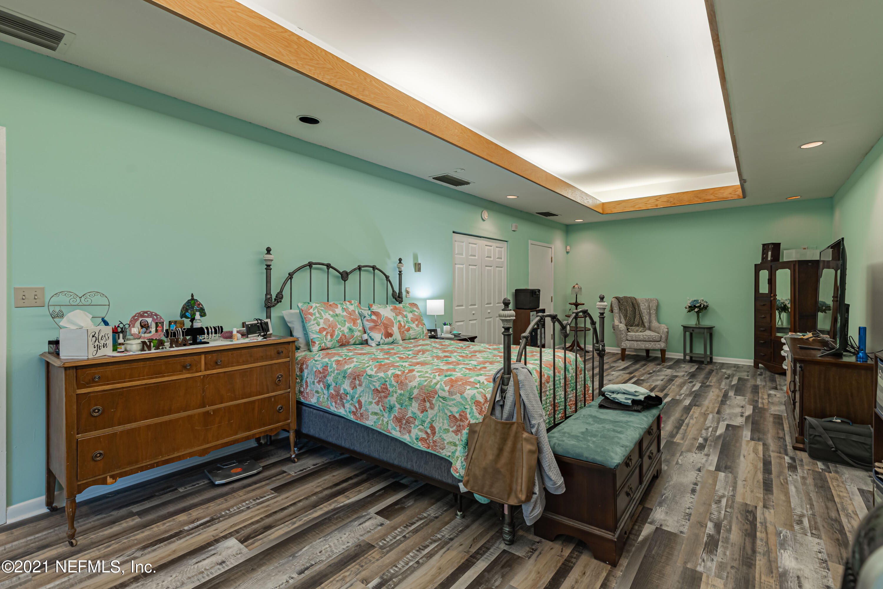 3155 Ravines Road, Unit 3502 Middleburg, FL 32068 - Photo 13 of 25 a bed room with furniture and wooden floor