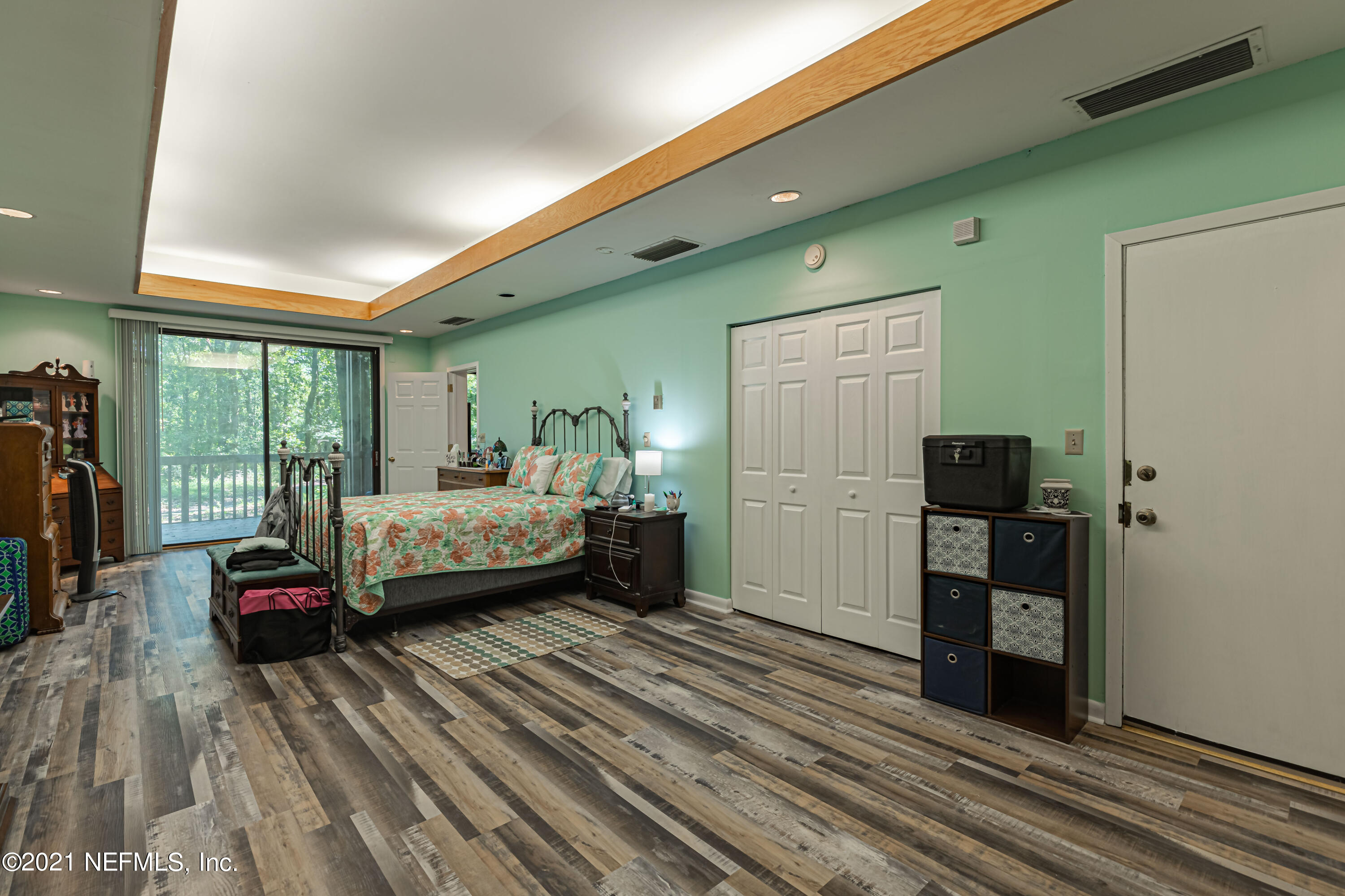 3155 Ravines Road, Unit 3502 Middleburg, FL 32068 - Photo 14 of 25 a bedroom with a bed and a large window