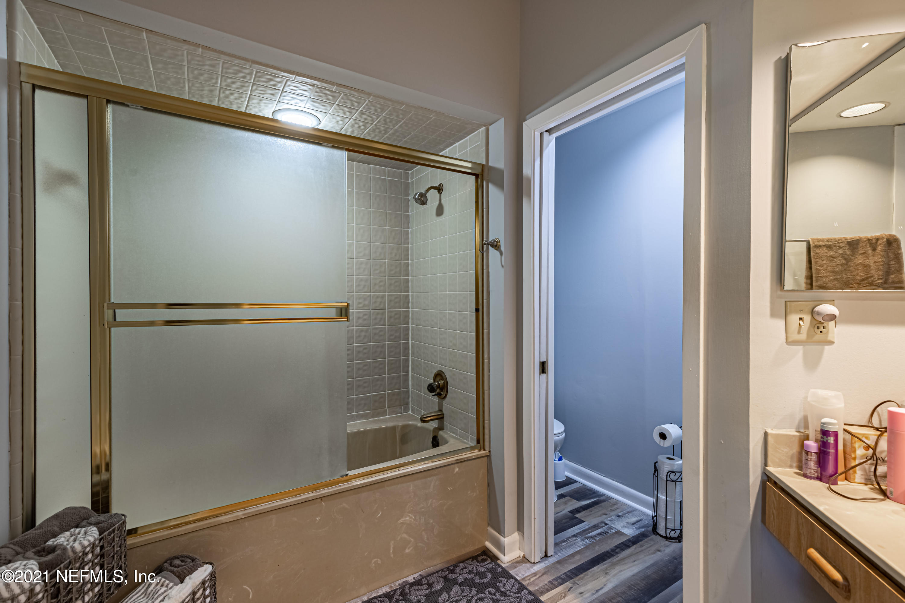 3155 Ravines Road, Unit 3502 Middleburg, FL 32068 - Photo 17 of 25 a bathroom with a shower and a toilet