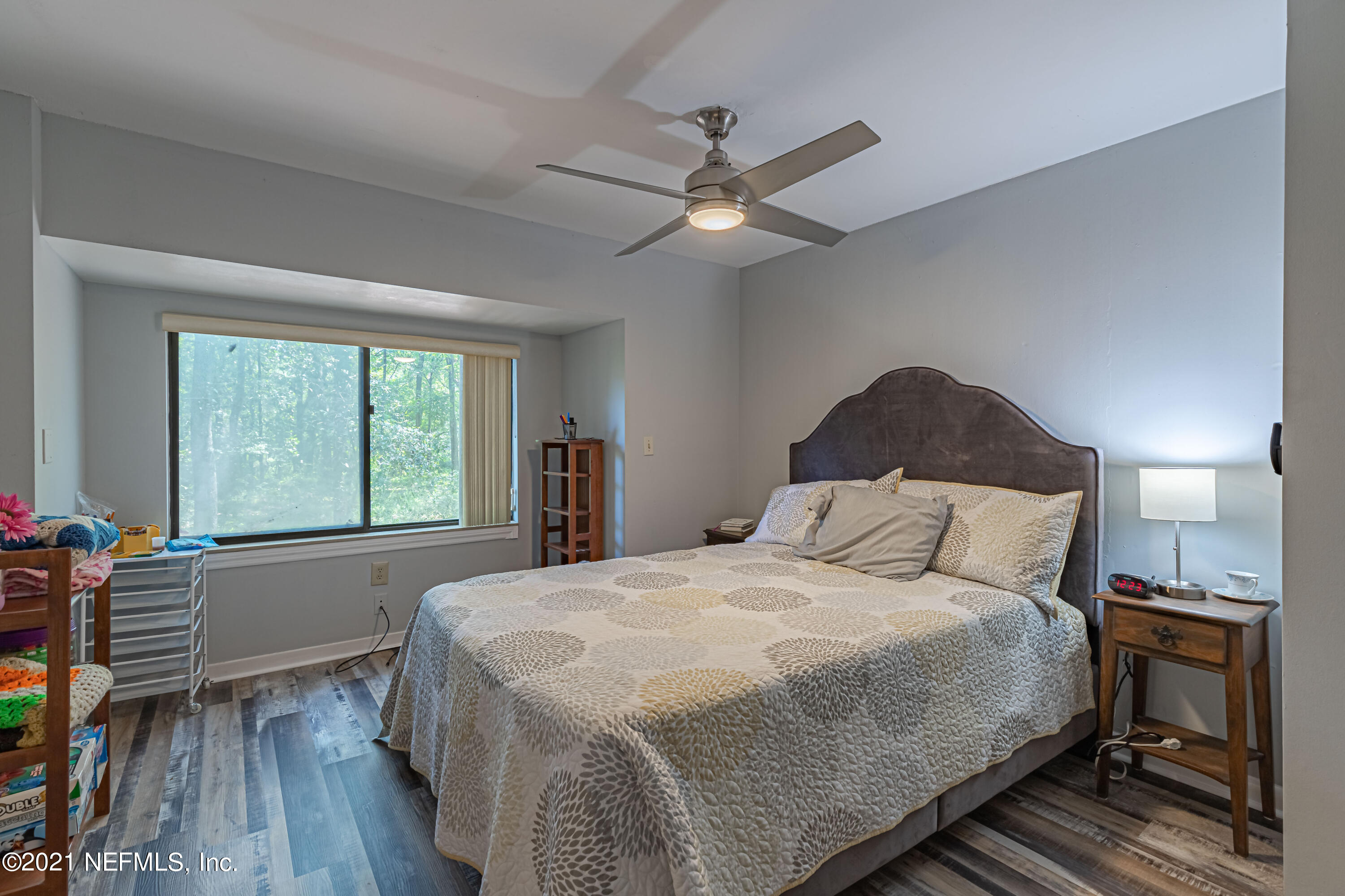 3155 Ravines Road, Unit 3502 Middleburg, FL 32068 - Photo 18 of 25 a bedroom with a large bed and a window