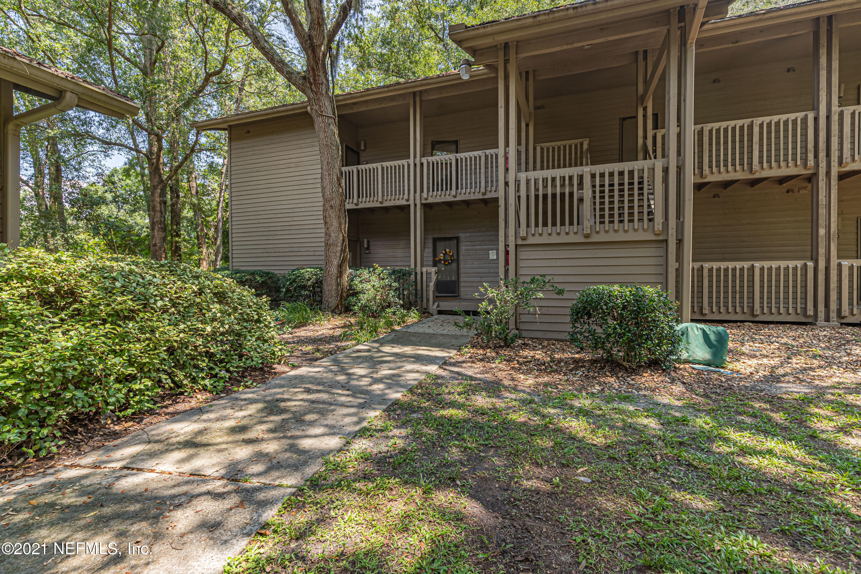 3155 Ravines Road, Unit 3502 Middleburg, FL 32068 - Photo 2 of 25 a view of a house with a yard and flower plants