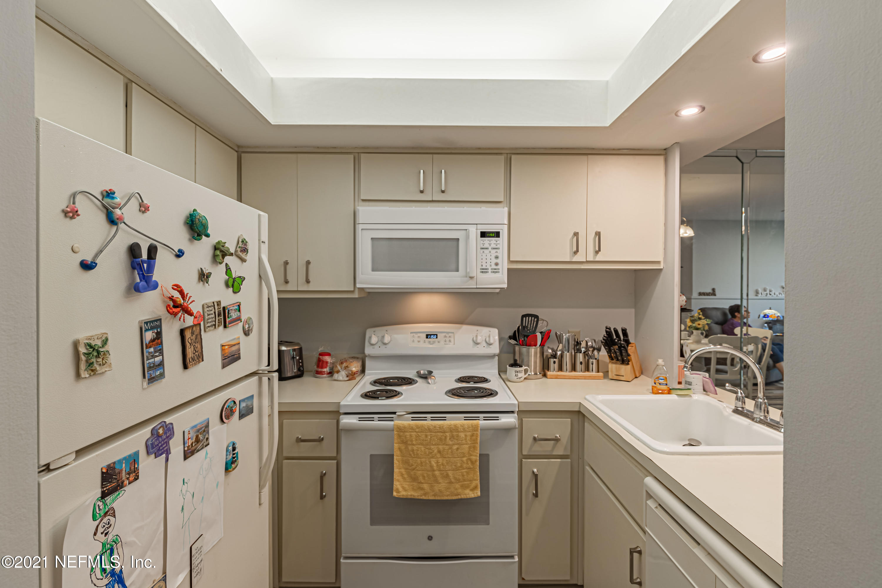 3155 Ravines Road, Unit 3502 Middleburg, FL 32068 - Photo 5 of 25 a kitchen with a refrigerator a stove and cabinets