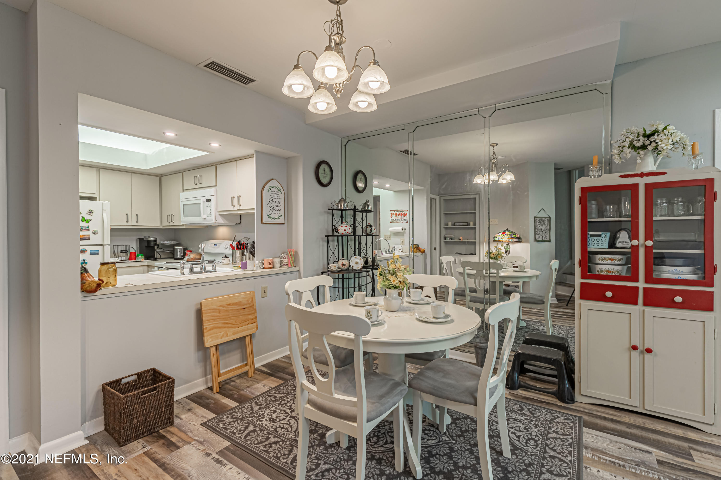 3155 Ravines Road, Unit 3502 Middleburg, FL 32068 - Photo 8 of 25 a view of a dining room with furniture and chandelier