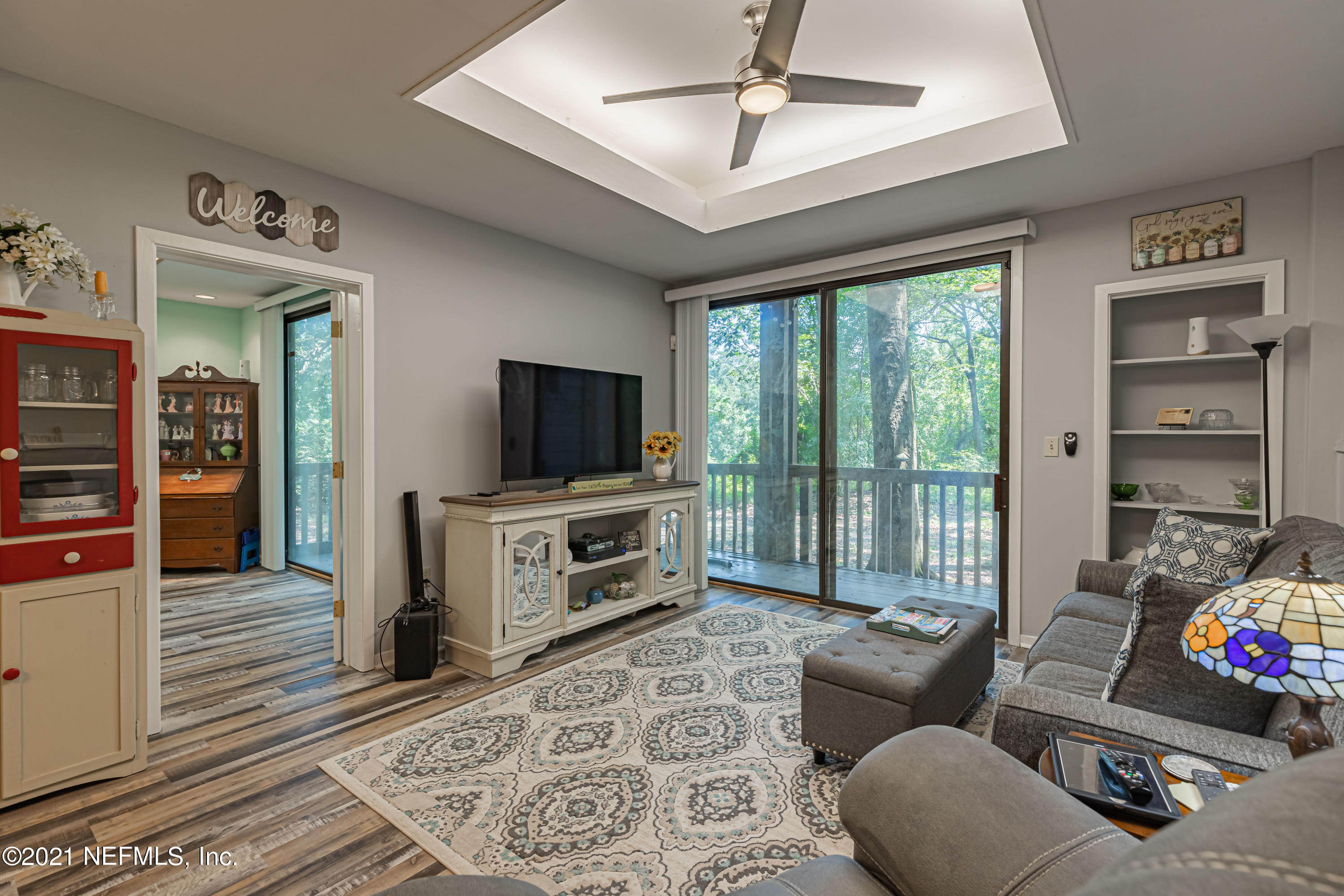 3155 Ravines Road, Unit 3502 Middleburg, FL 32068 - Photo 10 of 25 a living room with furniture and a flat screen tv