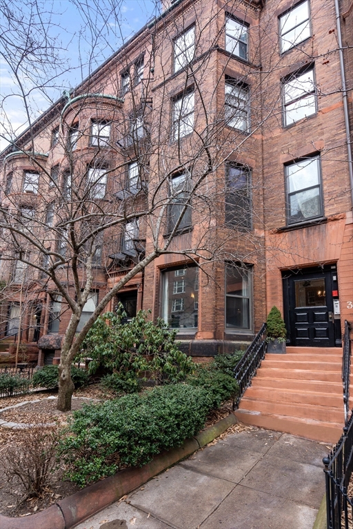 37 Bay State Road, Unit 3 Boston, MA 02215 - Photo 13 of 18 a front view of a building with yard