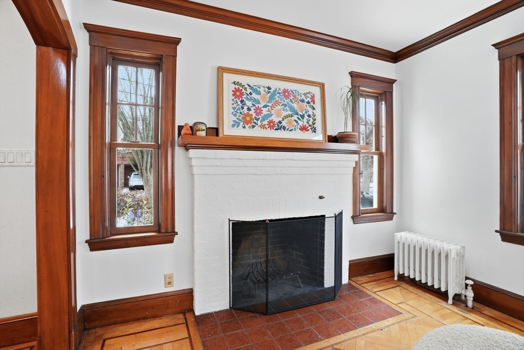 30 York Terrace Brookline, MA 02446 - Photo 16 of 39 a living room with furniture and a fireplace