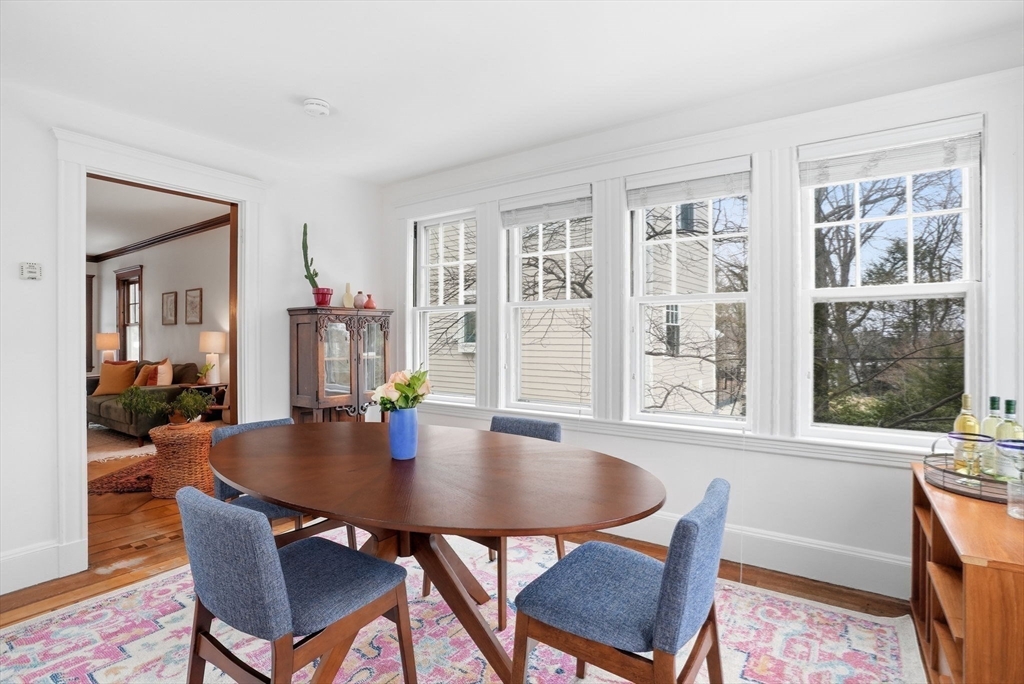 30 York Terrace Brookline, MA 02446 - Photo 20 of 39 a dining room with wooden floor and a table