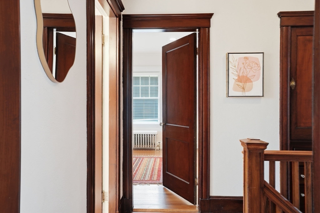 30 York Terrace Brookline, MA 02446 - Photo 22 of 39 a view of a hallway with wooden floor