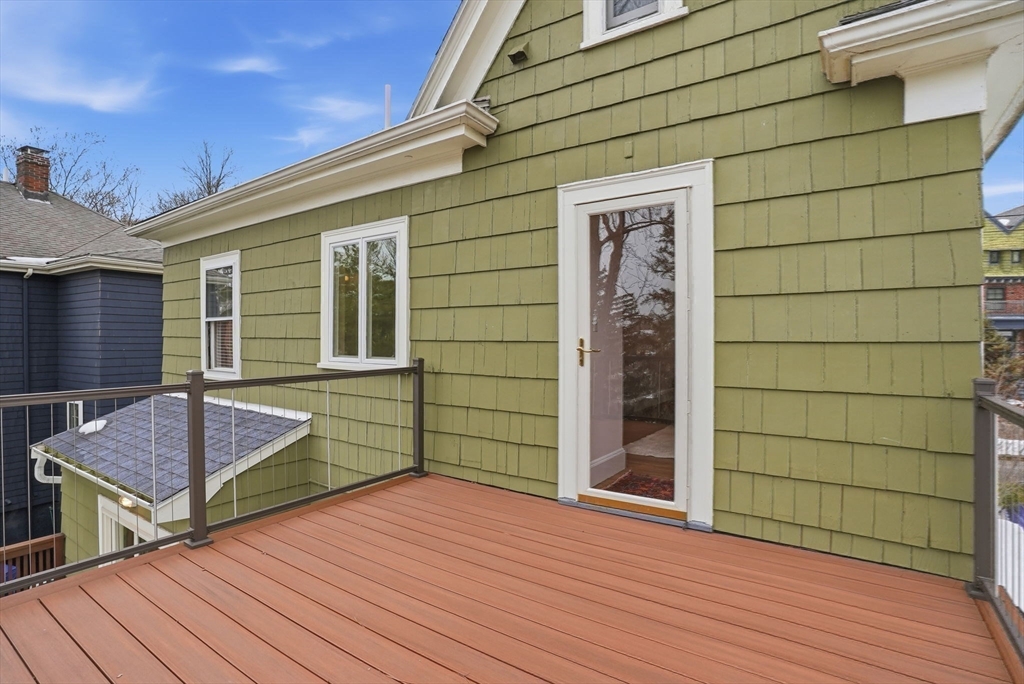 30 York Terrace Brookline, MA 02446 - Photo 27 of 39 a backyard of a house with wooden floor and seating space