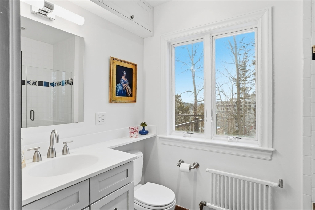 30 York Terrace Brookline, MA 02446 - Photo 31 of 39 a bathroom with a sink toilet and a window