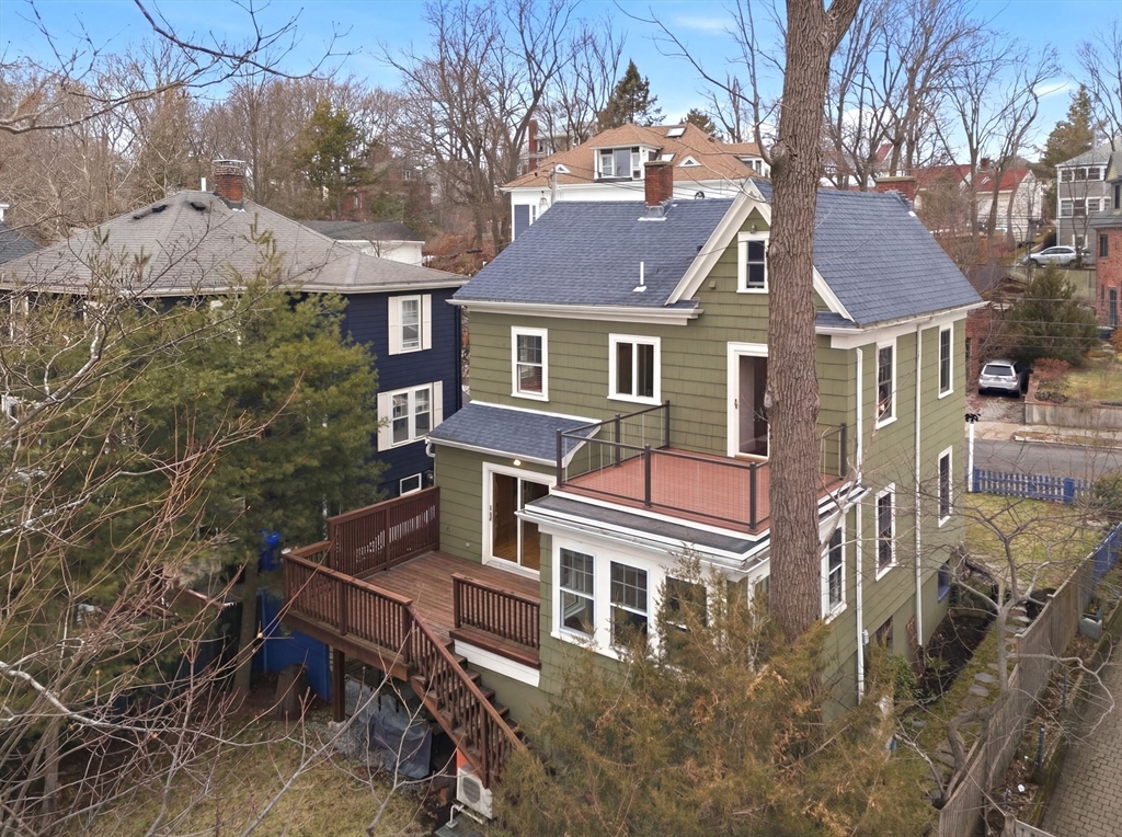 30 York Terrace Brookline, MA 02446 - Photo 34 of 39 a front view of a house with a yard and parking space