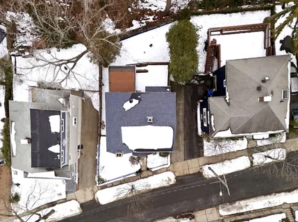 an aerial view of houses with yard