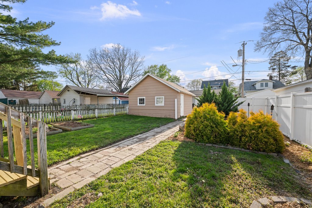 1179 26th Street Moline, IL 61265 - Photo 31 of 34 a view of a house with a small yard and large tree