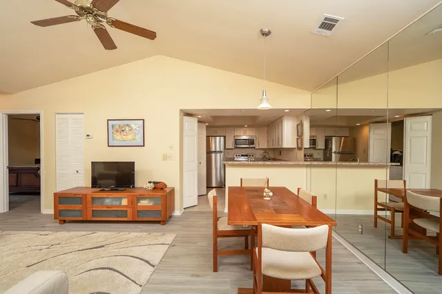 a bathroom with a granite countertop sink mirror and