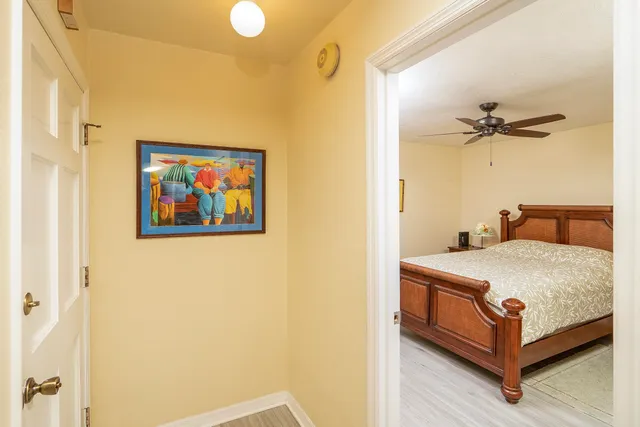 a bedroom with a bed and a dresser