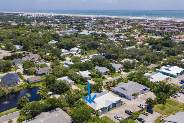 a view of swimming pool with a patio and a yard
