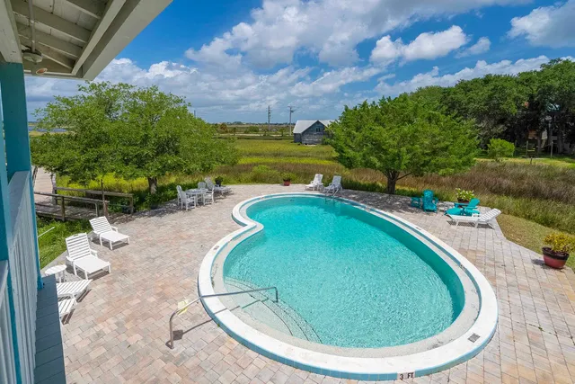 a view of swimming pool with a patio