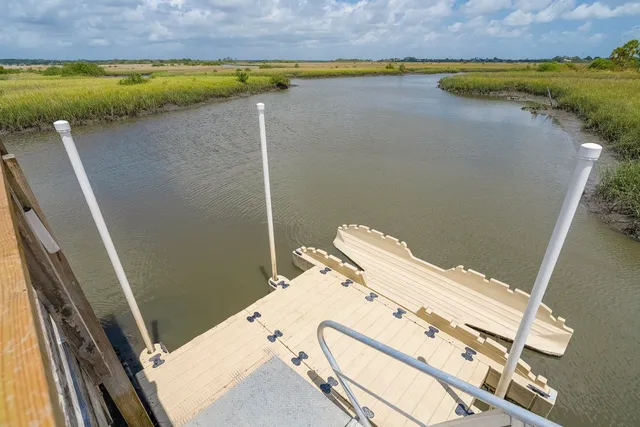 a view of a lake with a yard