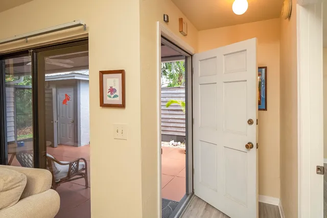 a living room with furniture and a ceiling fan
