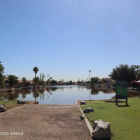 a view of a lake with houses in the back