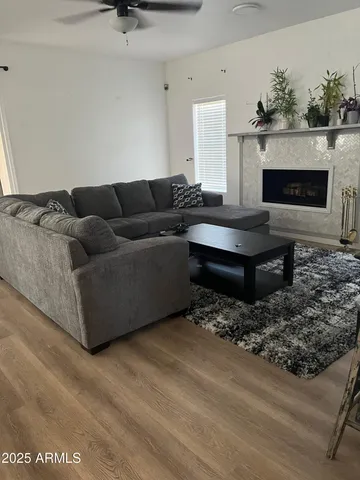 a living room with furniture and a fireplace