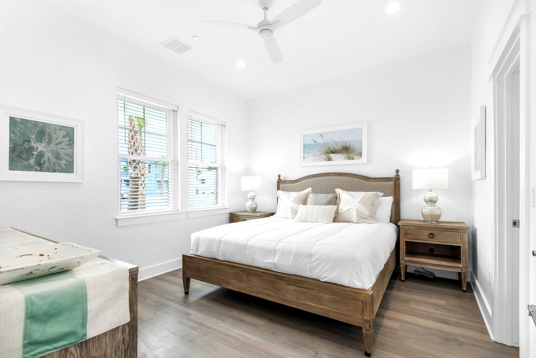 4543 Luke Avenue Destin, FL 32541 - Photo 18 of 45 a bedroom with a bed and wooden floor