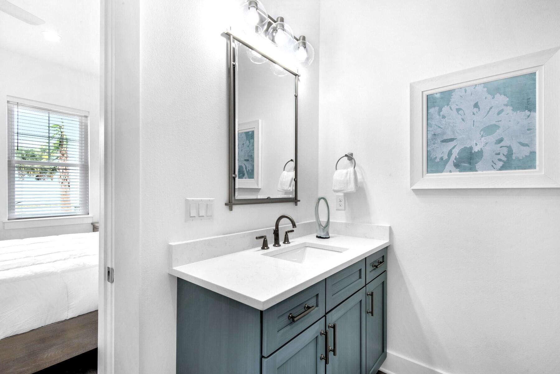 4543 Luke Avenue Destin, FL 32541 - Photo 21 of 45 a bathroom with a sink and a mirror