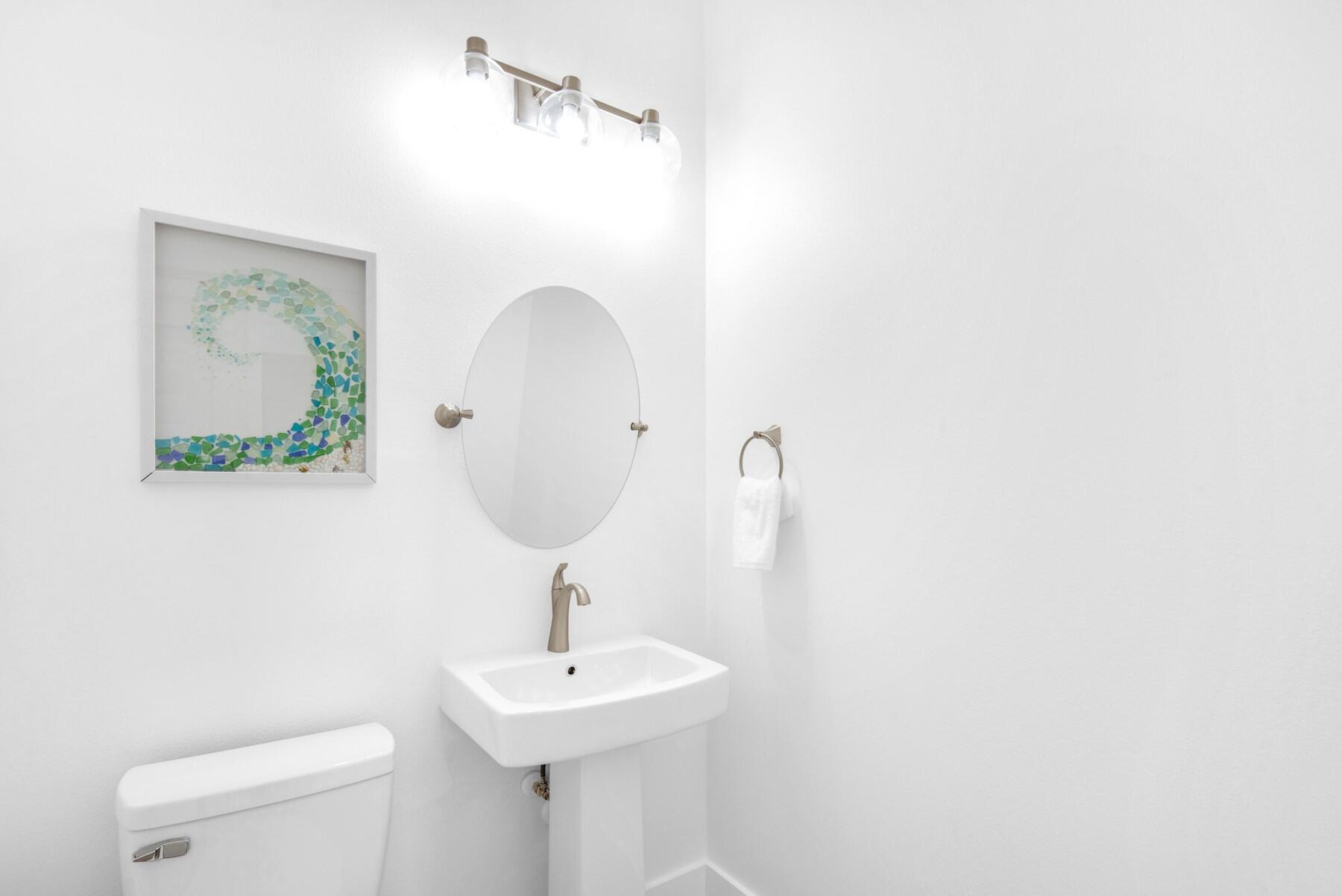 4543 Luke Avenue Destin, FL 32541 - Photo 22 of 45 a bathroom with a sink and mirror