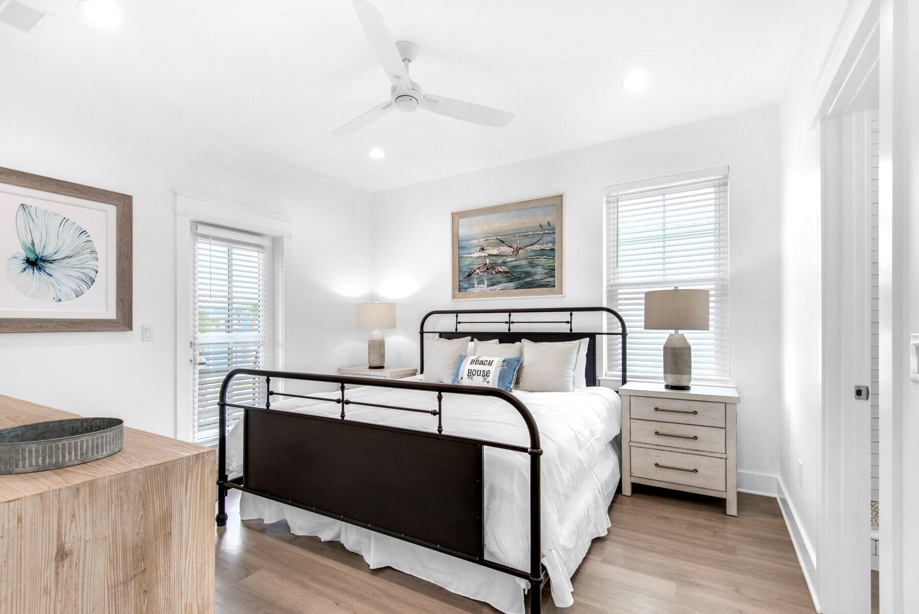 4543 Luke Avenue Destin, FL 32541 - Photo 26 of 45 a bedroom with a bed and a night stand