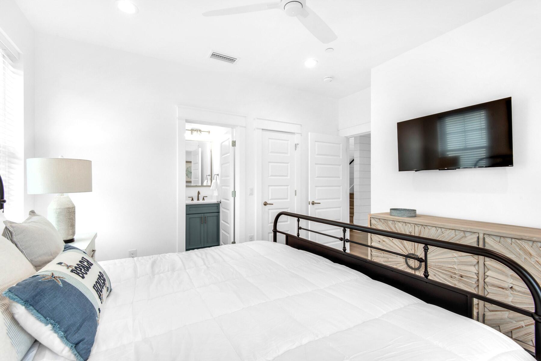 4543 Luke Avenue Destin, FL 32541 - Photo 27 of 45 a bedroom with a bed and a flat screen tv