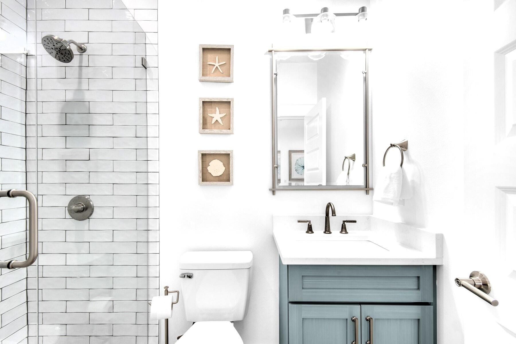 4543 Luke Avenue Destin, FL 32541 - Photo 28 of 45 a bathroom with a sink a toilet and shower