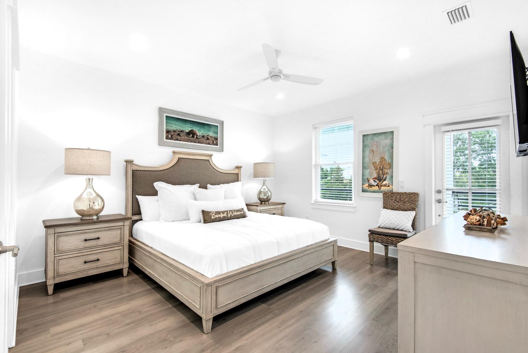 4543 Luke Avenue Destin, FL 32541 - Photo 30 of 45 a bedroom with a bed and large windows