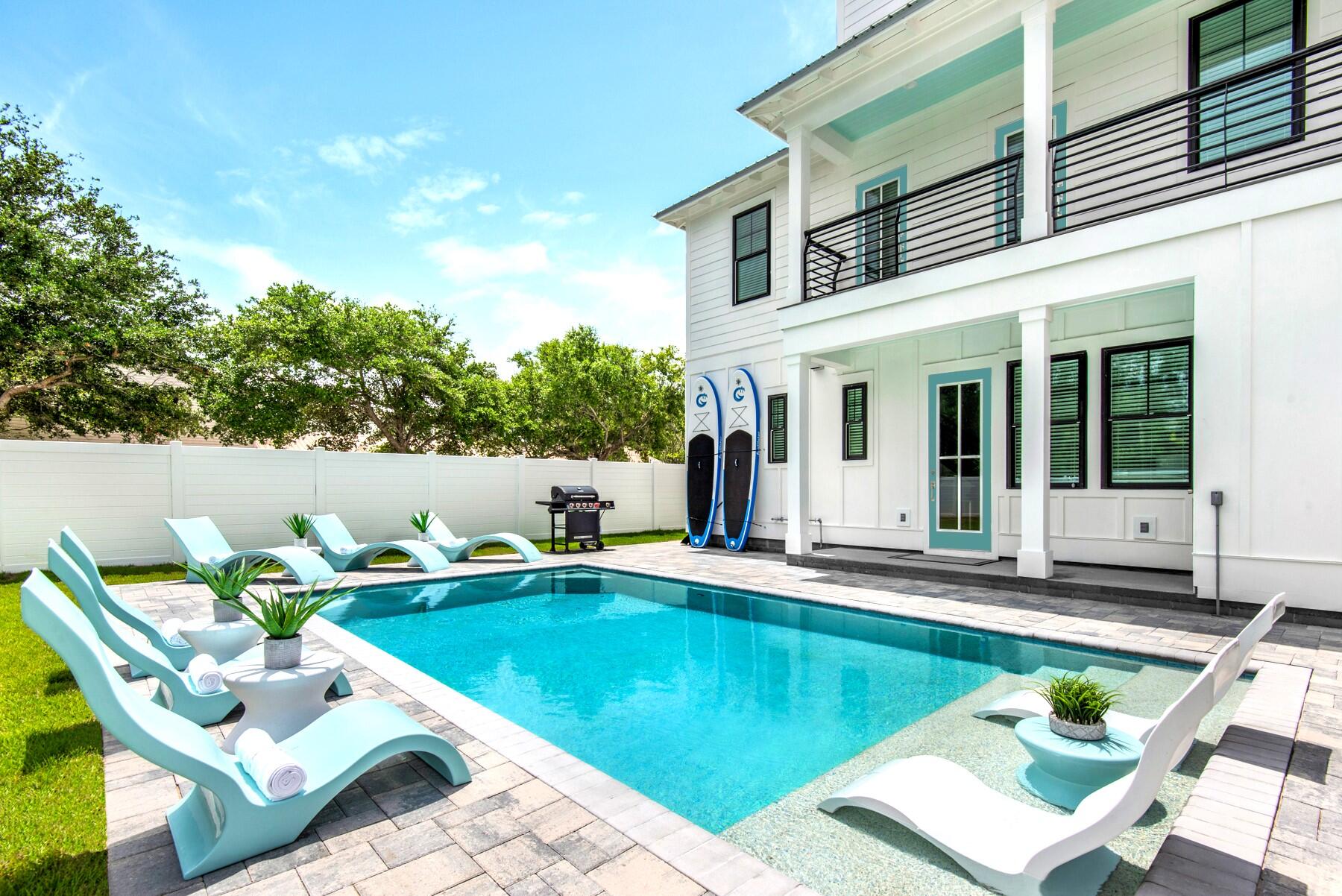 4543 Luke Avenue Destin, FL 32541 - Photo 3 of 45 a swimming pool with outdoor seating and yard