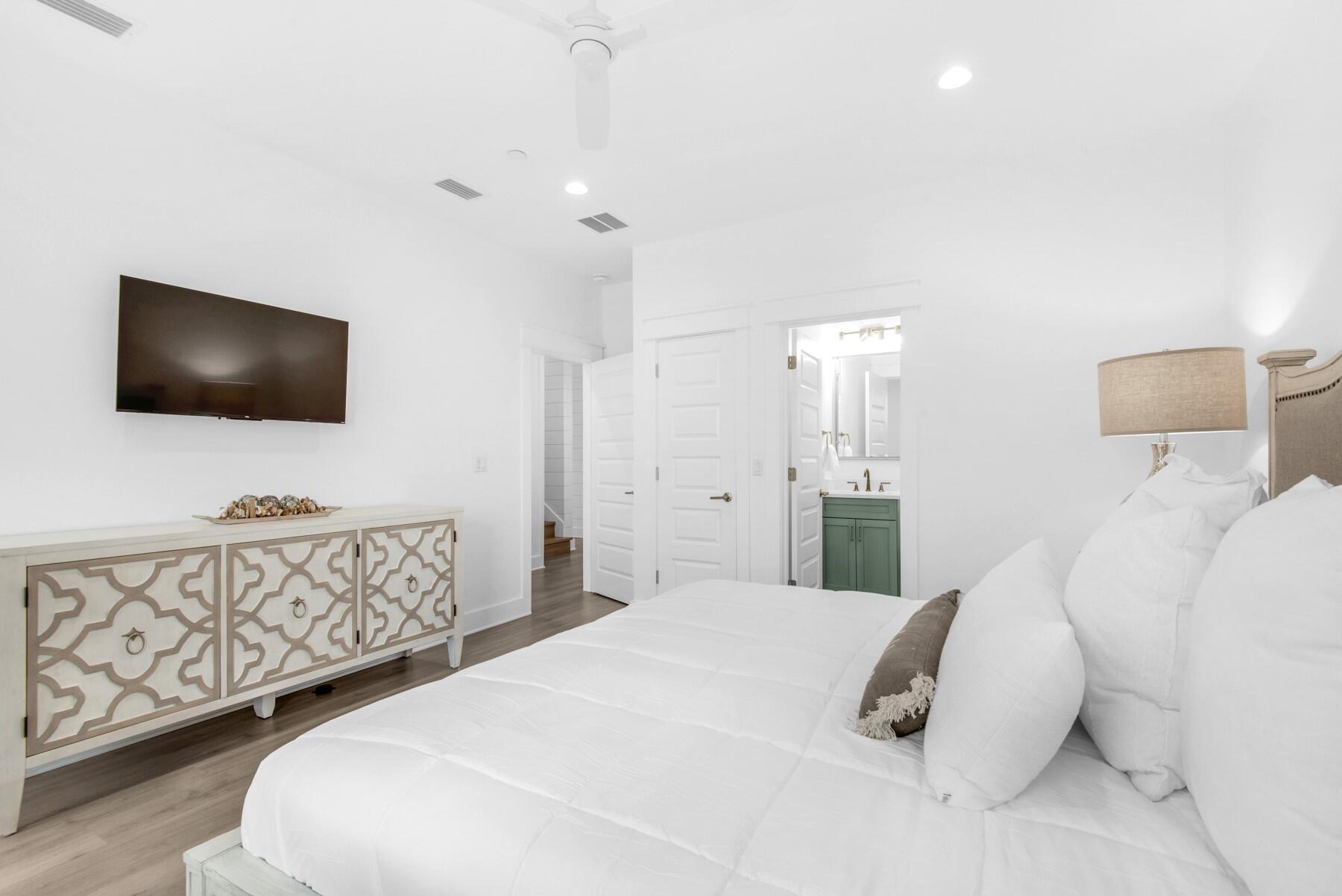 4543 Luke Avenue Destin, FL 32541 - Photo 31 of 45 a bedroom with a bed and a flat screen tv