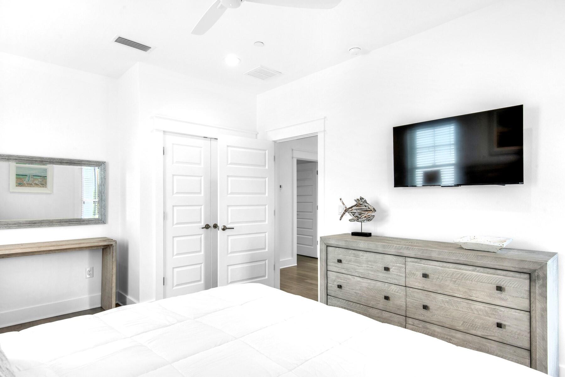 4543 Luke Avenue Destin, FL 32541 - Photo 40 of 45 a bedroom with a bed and a flat screen tv