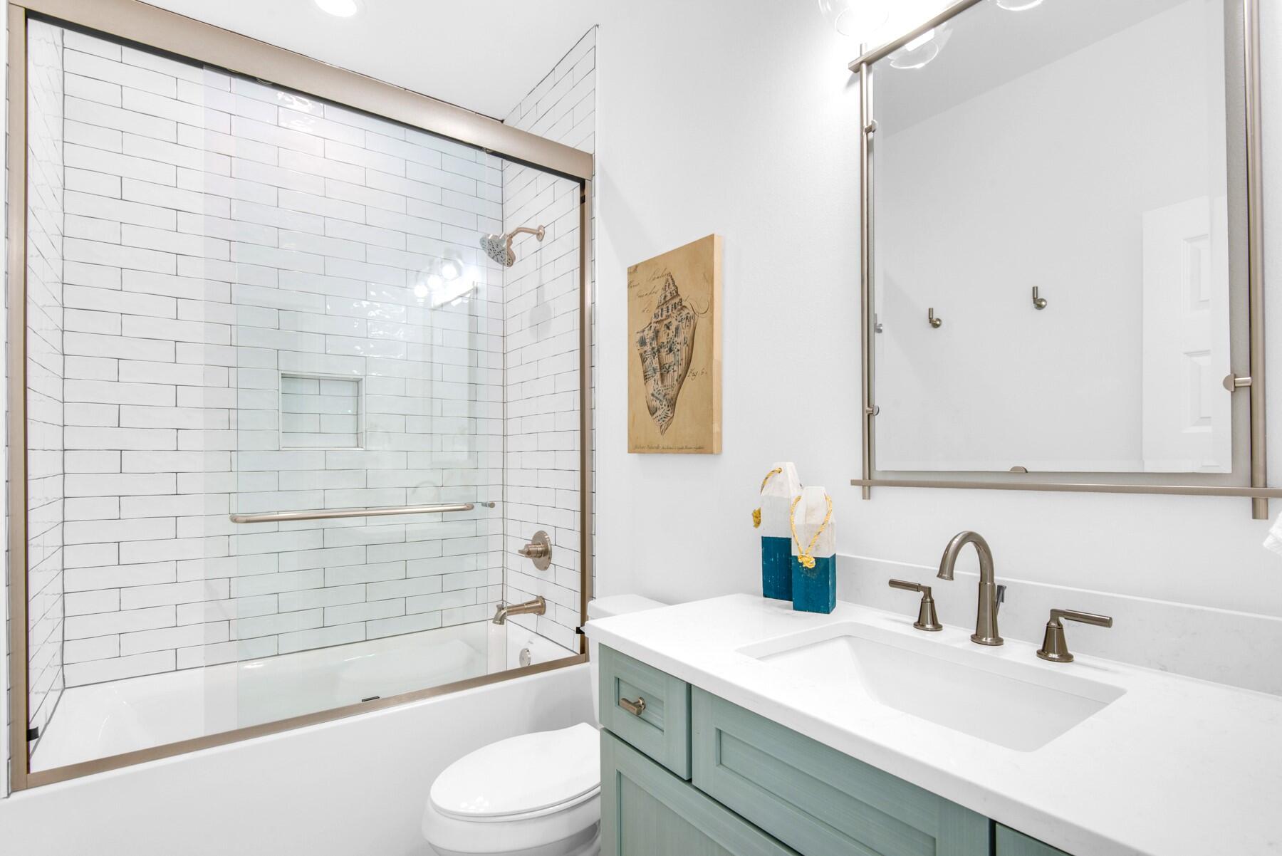 4543 Luke Avenue Destin, FL 32541 - Photo 41 of 45 a bathroom with a sink toilet and shower