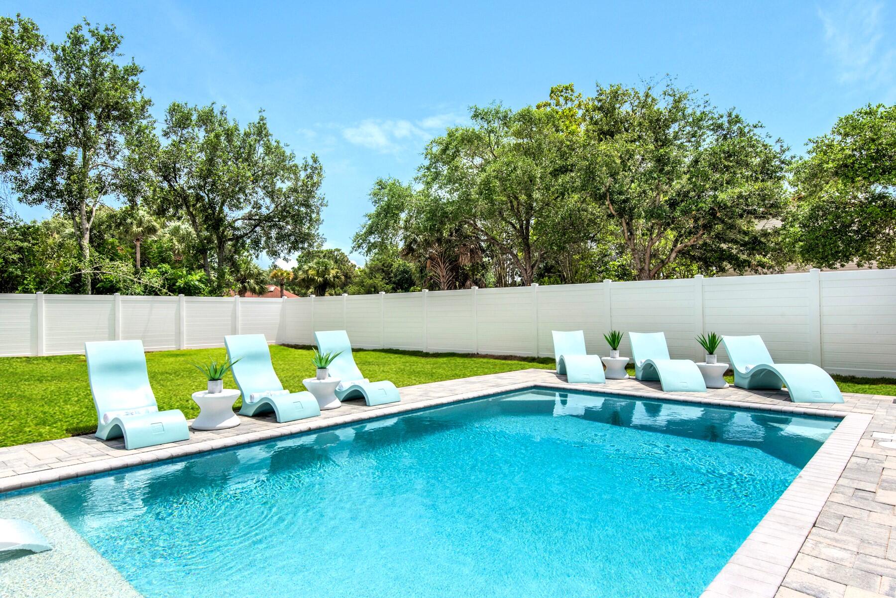 4543 Luke Avenue Destin, FL 32541 - Photo 8 of 45 a view of a swimming pool with a lounge chair