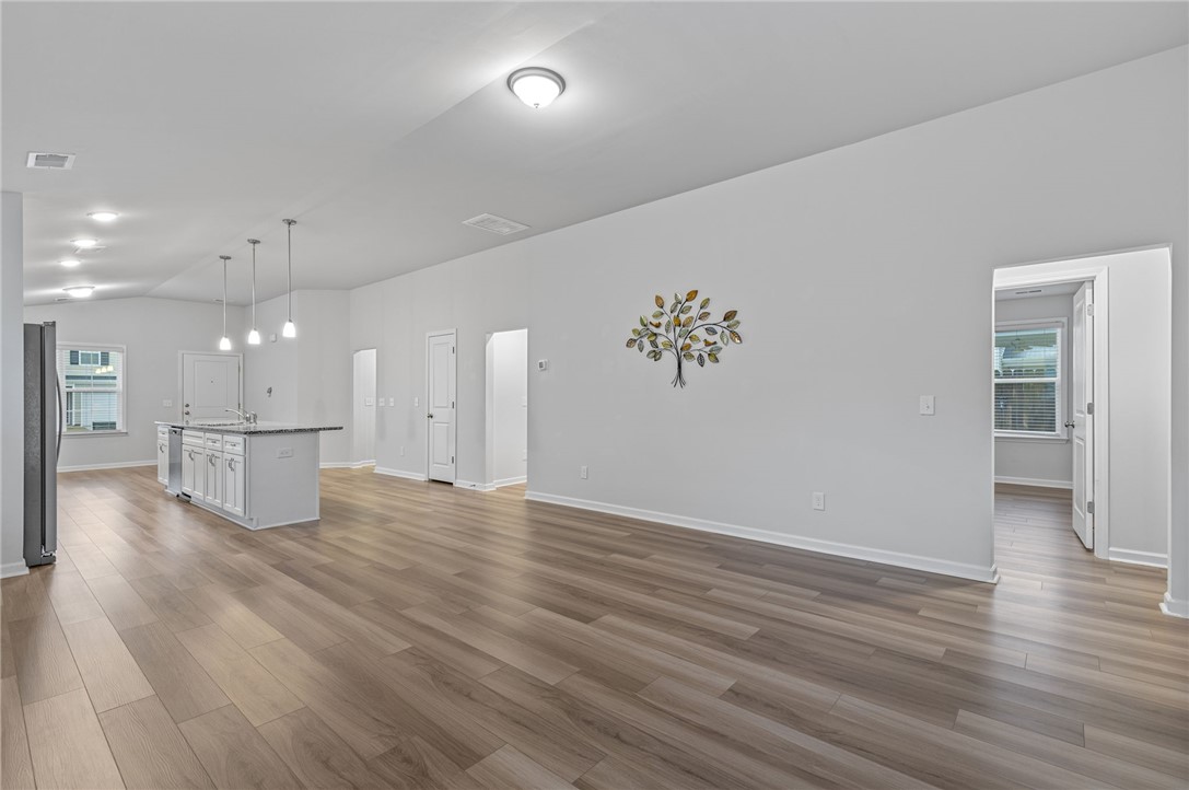 24 Chalet Court Anderson, SC 29621 - Photo 15 of 39 This airy open-concept living area features a kitchen island and abundant natural light.