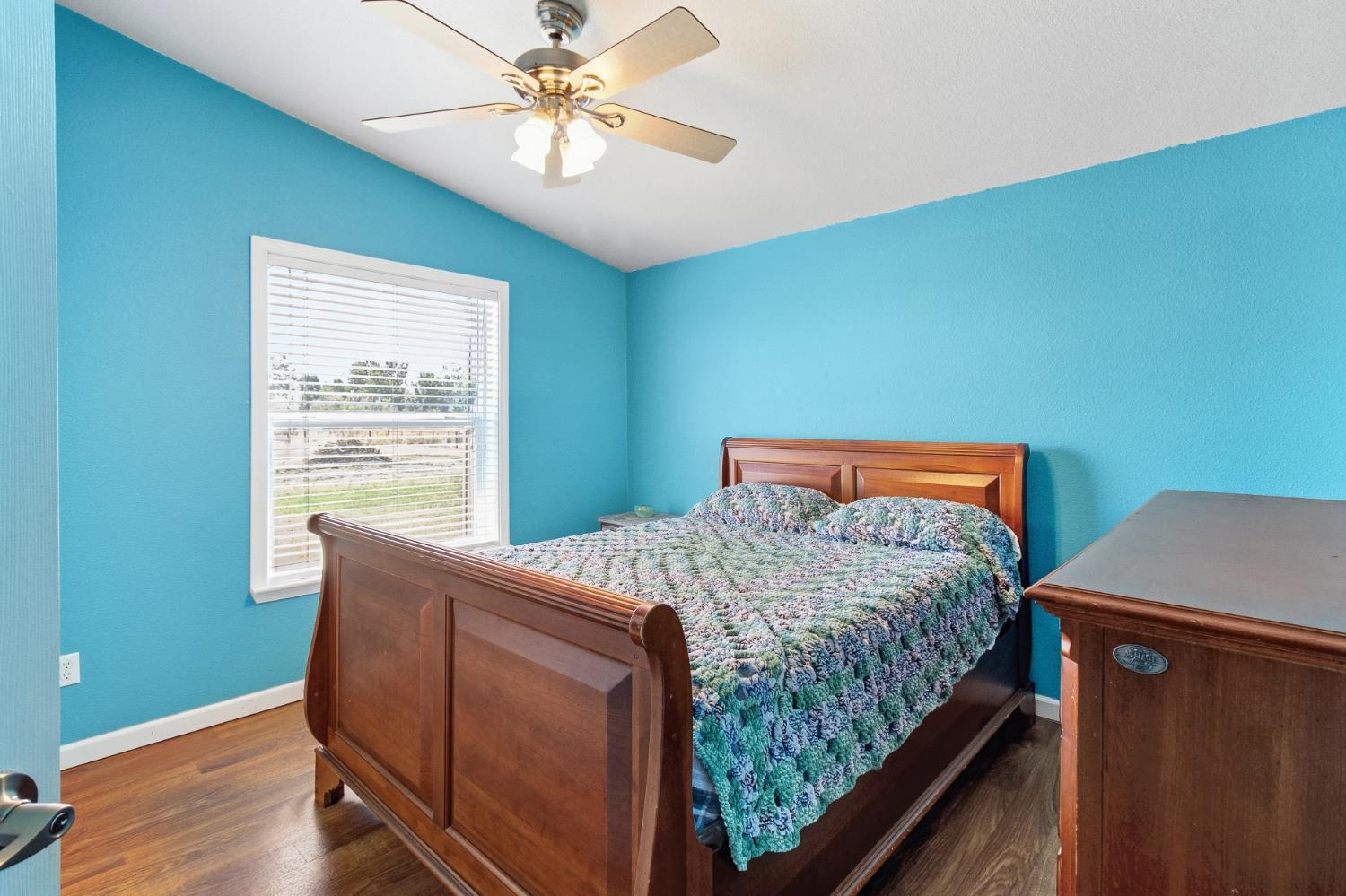 12390 Hobday Road Wilton, CA 95693 - Photo 37 of 92 a bed sitting in a bedroom next to a window