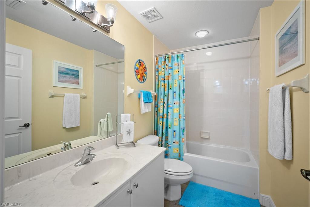 4455 Botanical Pl Circle, Unit 405 Naples, FL 34112 - Photo 14 of 46 a bathroom with a sink toilet and shower
