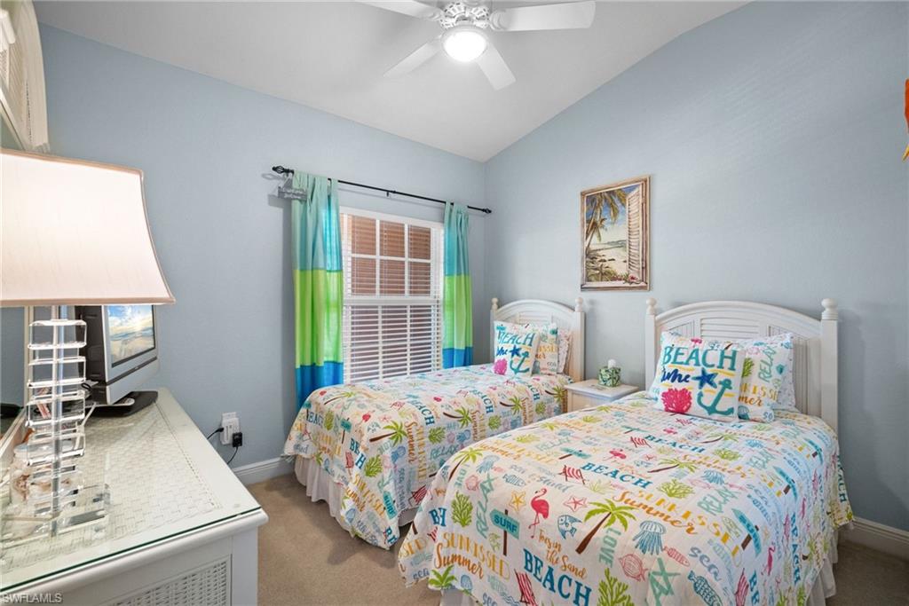 4455 Botanical Pl Circle, Unit 405 Naples, FL 34112 - Photo 15 of 46 a bedroom with two beds and a window