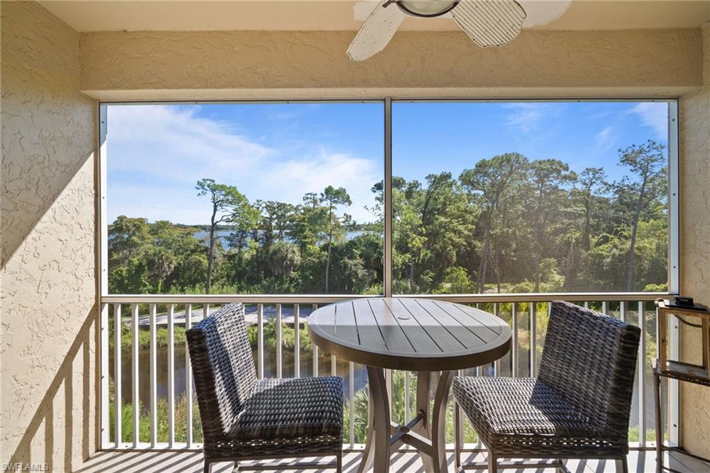 4455 Botanical Pl Circle, Unit 405 Naples, FL 34112 - Photo 25 of 46 a view of a balcony with chairs