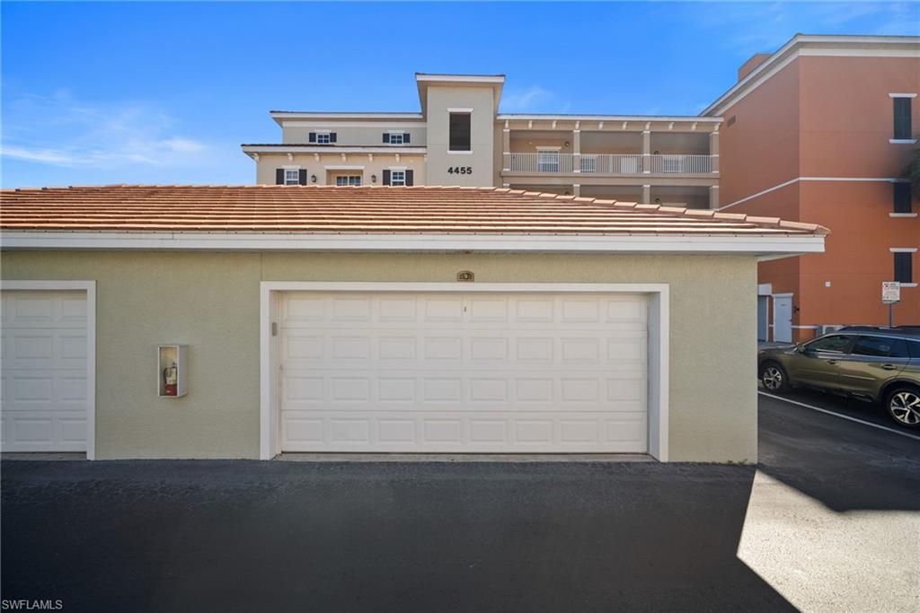 4455 Botanical Pl Circle, Unit 405 Naples, FL 34112 - Photo 28 of 46 a view of kitchen with a sink