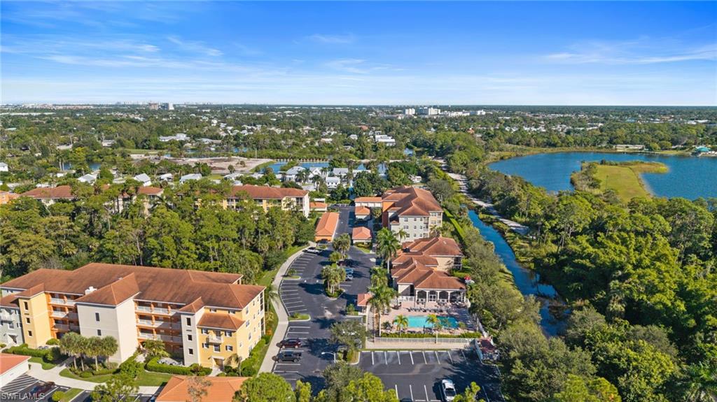 4455 Botanical Pl Circle, Unit 405 Naples, FL 34112 - Photo 39 of 46 an aerial view of residential houses with outdoor space and river
