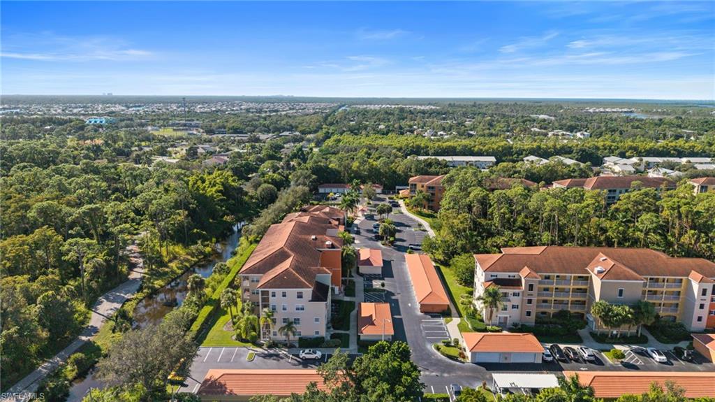 4455 Botanical Pl Circle, Unit 405 Naples, FL 34112 - Photo 42 of 46 an aerial view of a city