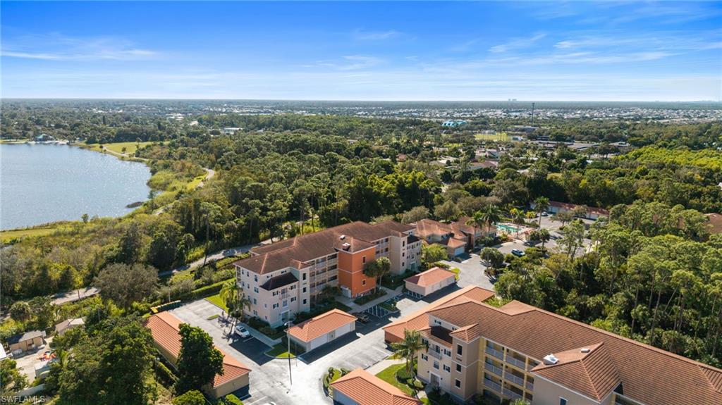 4455 Botanical Pl Circle, Unit 405 Naples, FL 34112 - Photo 44 of 46 an aerial view of a city with lots of residential buildings